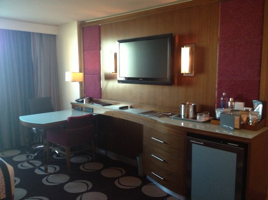 TV and desk plus mini fridge.