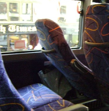 seats in a bus with a window