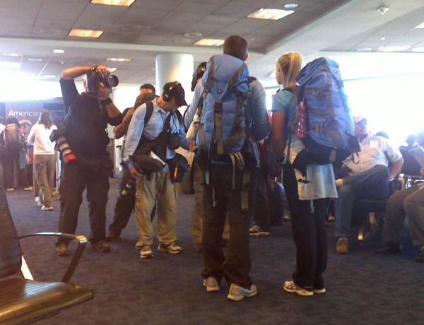 a group of people with backpacks