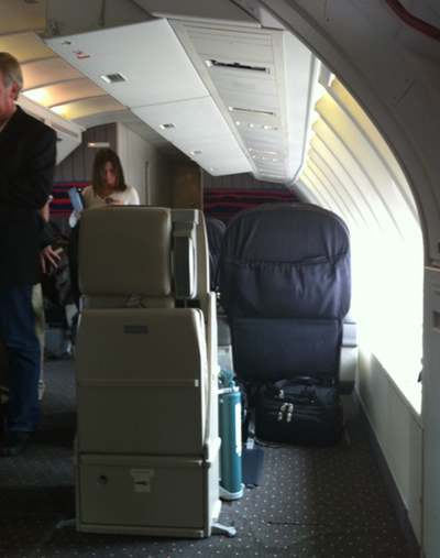 a group of people standing in an airplane