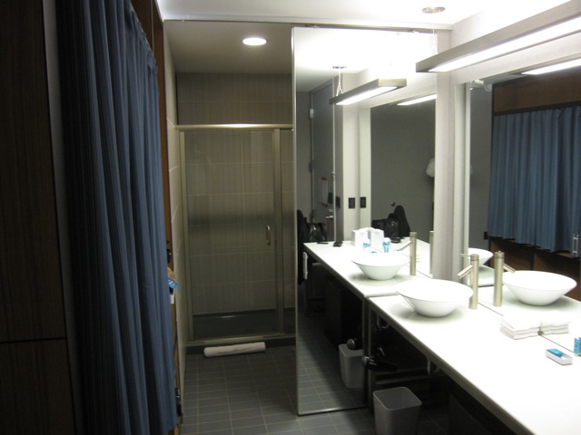 a bathroom with a shower and sink