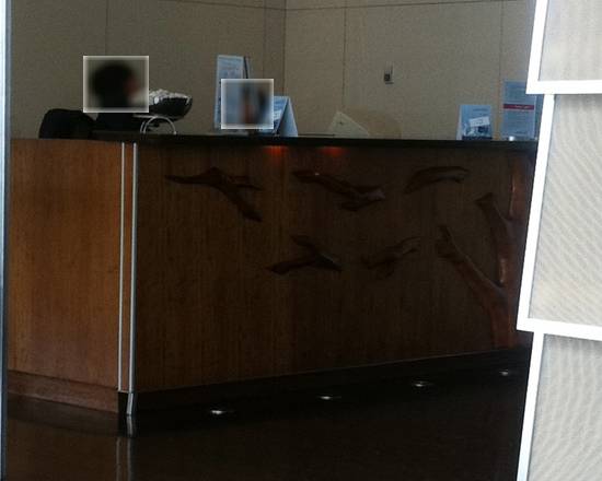 a reception desk with a person's face on it
