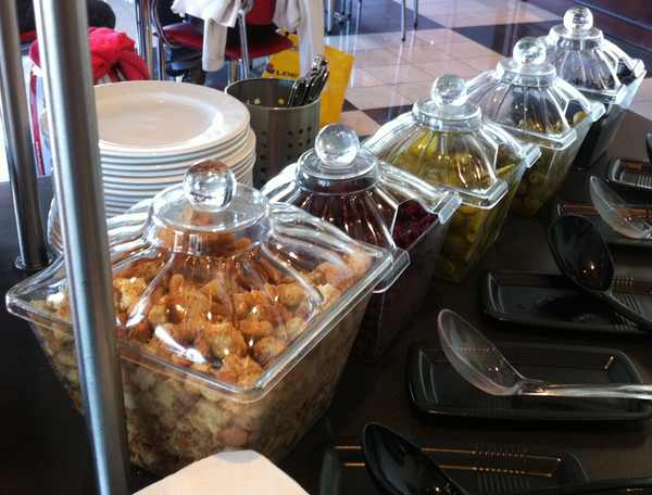 a row of containers of food
