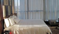 a bedroom with a large window