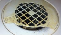 a circular drain with a hole in it
