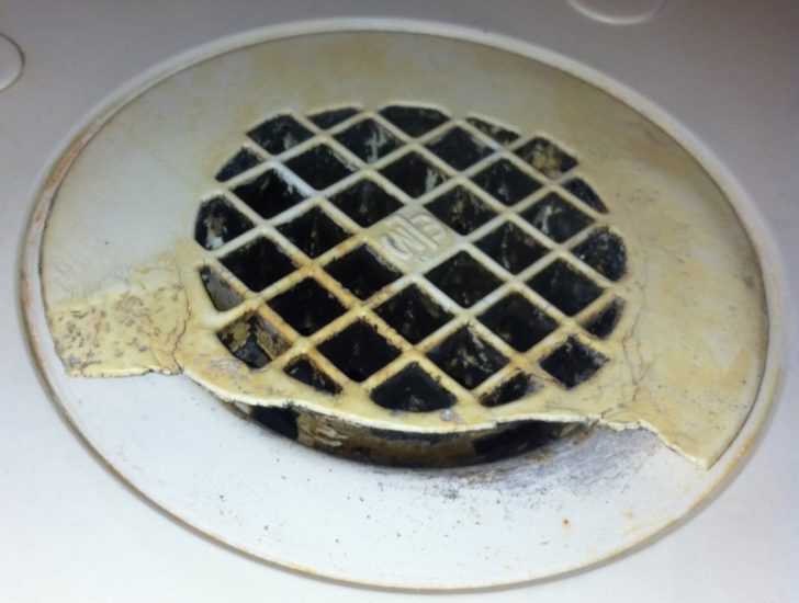 a circular drain with a hole in it