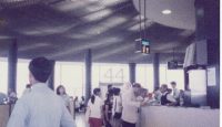 people standing in a line at a counter