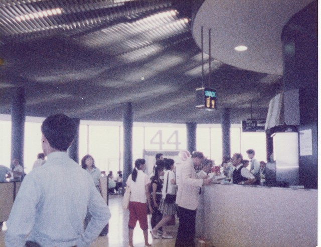 people standing in a line at a counter