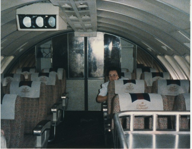 a woman sitting in an airplane