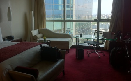 a hotel room with a view of the city
