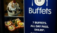 a blue sign with different foods on it