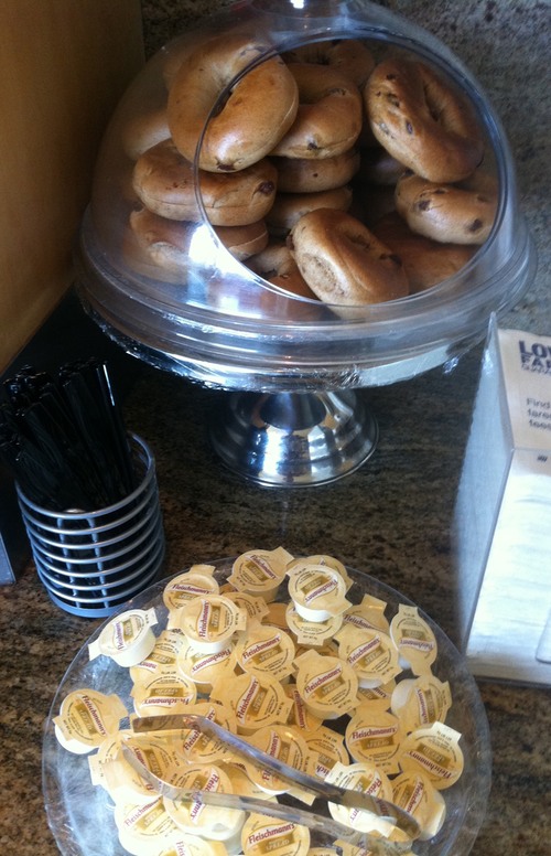 bagels in a glass container on a counter