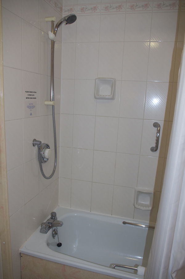 a shower and bathtub in a bathroom