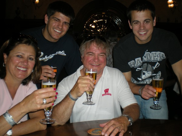 a group of people holding glasses of beer