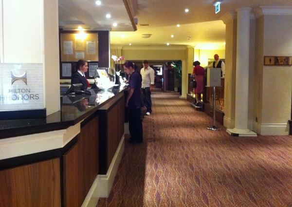 people standing in a hotel lobby
