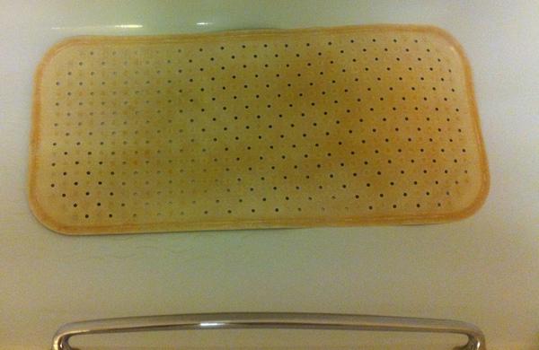 a brown mat with holes on it
