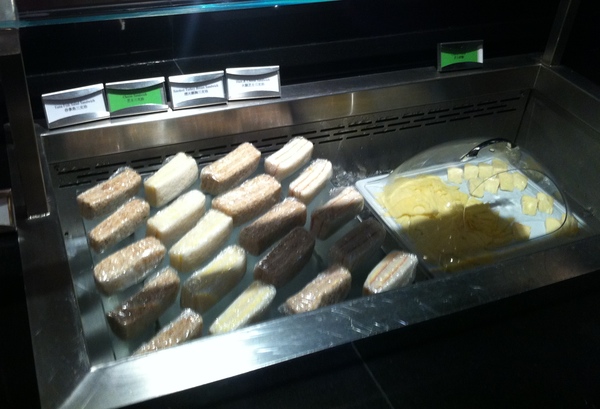 a tray of food wrapped in plastic