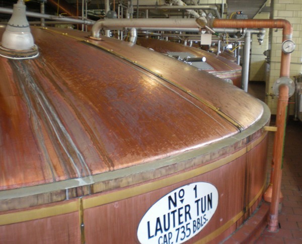 a large copper tank with pipes