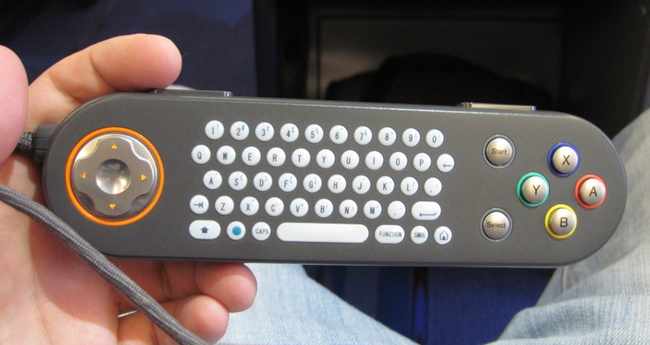 a hand holding a small keyboard