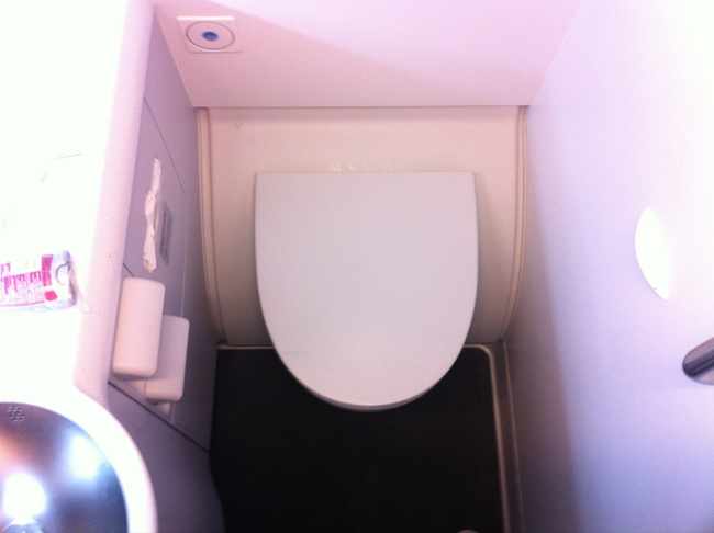a toilet in a small bathroom