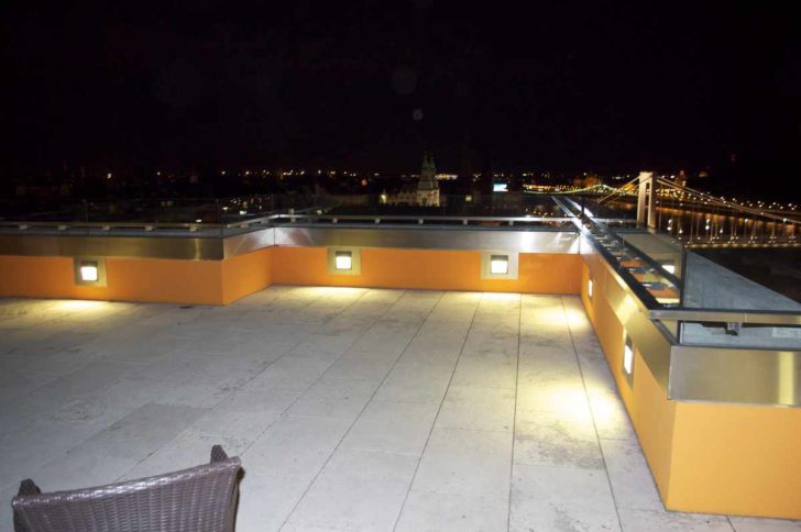 a rooftop with a view of the city