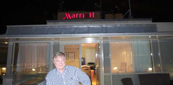a man standing in front of a hotel
