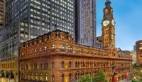 a building with a clock tower in the background