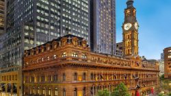 a building with a clock tower in the background