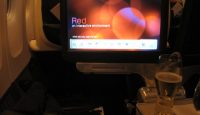 a screen on the seat of an airplane