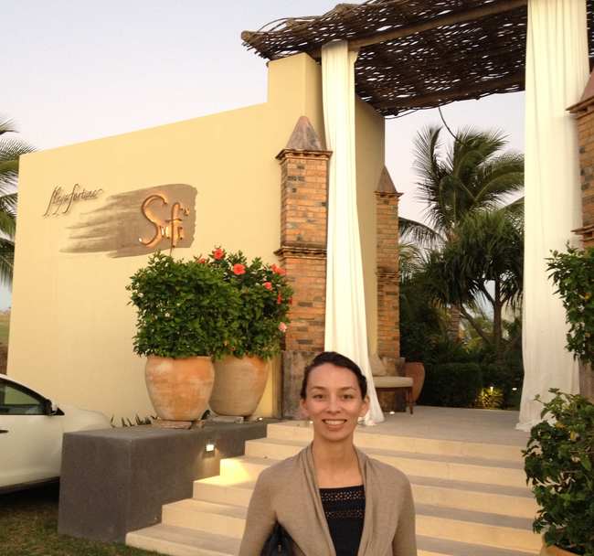 a woman standing in front of a building