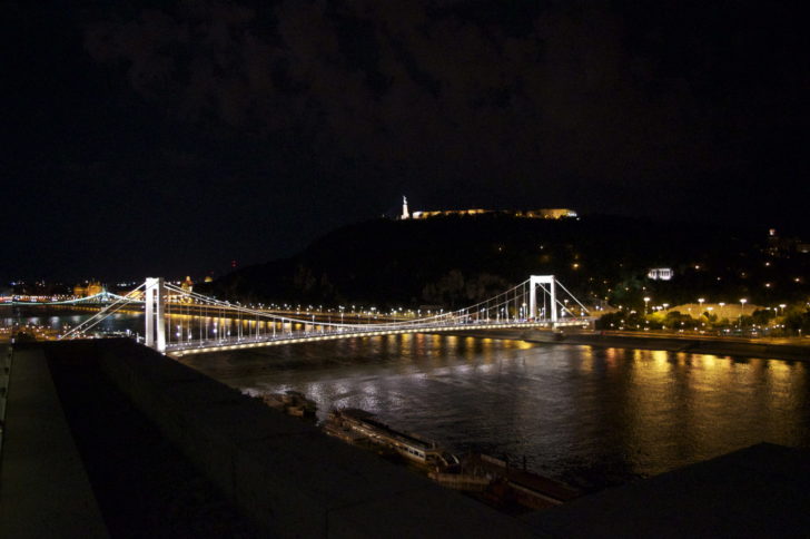 a bridge over a river at night