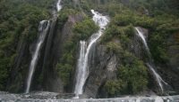 a waterfall in the mountains