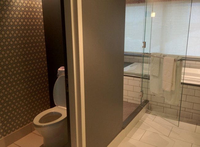 a bathroom with a glass shower door