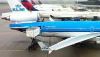 a group of airplanes at an airport