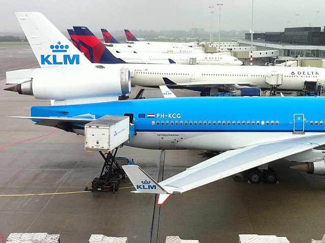 a group of airplanes at an airport