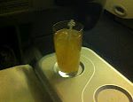 a glass of liquid on a tray