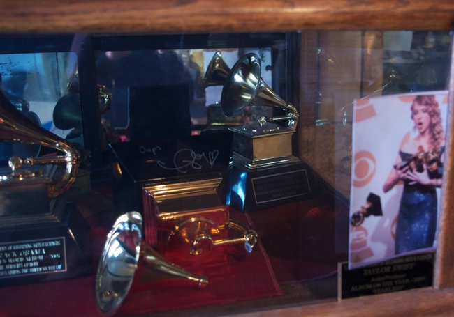 a group of trophies in a case