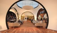 a room with circular windows and a circular ceiling