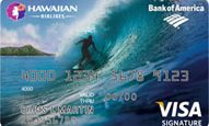 a credit card with a person surfing on a wave