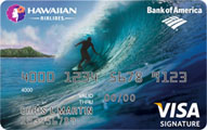 a credit card with a person surfing on a wave