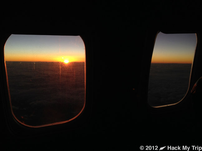 view of ocean sunrise from a plane