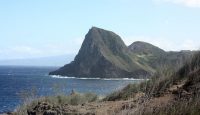 a rocky island with a body of water