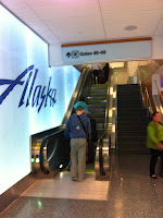 a person standing on an escalator