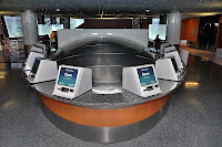a group of computers on a round table