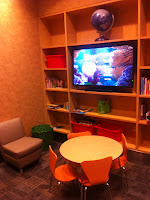 a room with a table and a tv