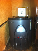 a black machine with a sign on top