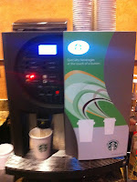 a coffee machine with a blue and green label