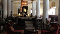 a room with a large table and chairs