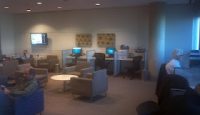 people sitting in a room with computers