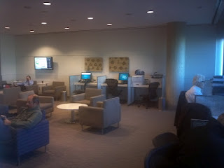 people sitting in a room with computers